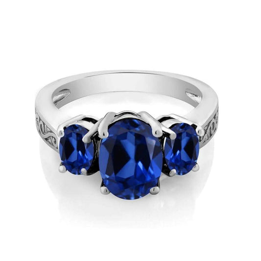 Oval Cut Tri Stone Blue Topaz Ring - Assorted Sizes DailySale
