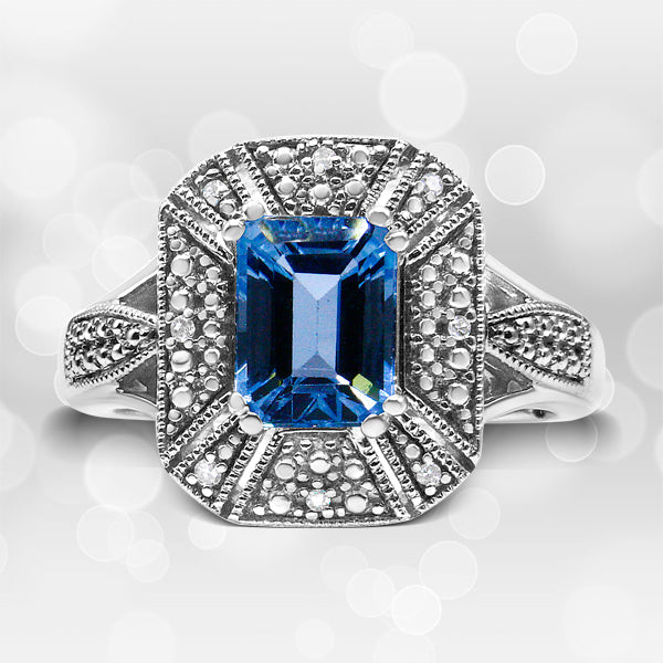 .925 Sterling Silver Diamond Accent and 8X6 mm Emerald-Shape Blue Topaz Ring (I-J Color, I2-I3 Clarity) - Ring Size 7 Bids.com