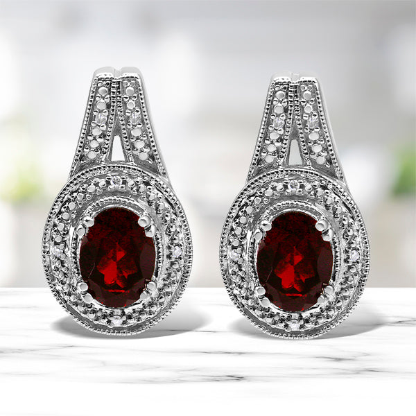 .925 Sterling Silver Diamond Accent and 8x6mm Red Oval Garnet Stud Earrings (I-J Color, I1-I2 Clarity) Bids.com