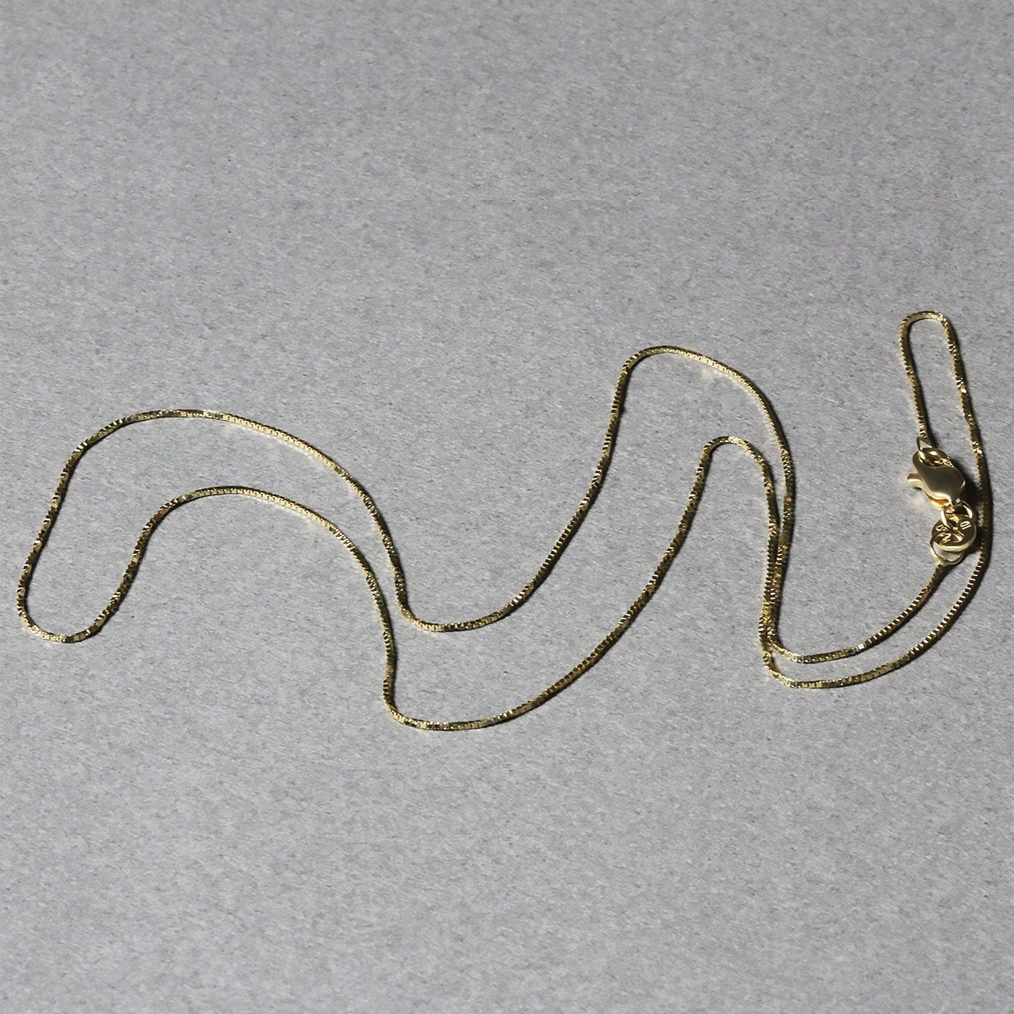 14k Yellow Gold Classic Box Chain 0.6mm Bids.com