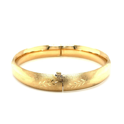 Classic Floral Carved Bangle in 14k Yellow Gold (10.0mm) Bids.com