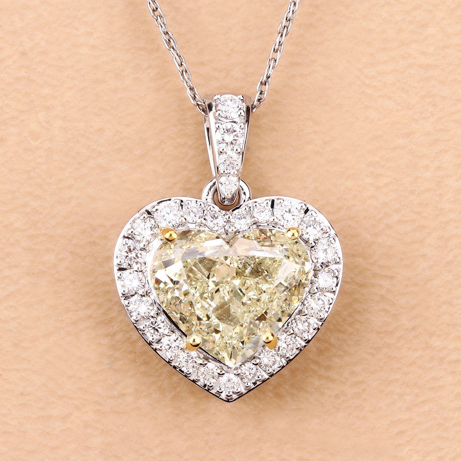 IGI Certified 4.51 Carat Genuine Light Yellow Diamond Center and 0.45cttw White Diamond 18K White Gold Pendant (4.96cttw) Bids.com