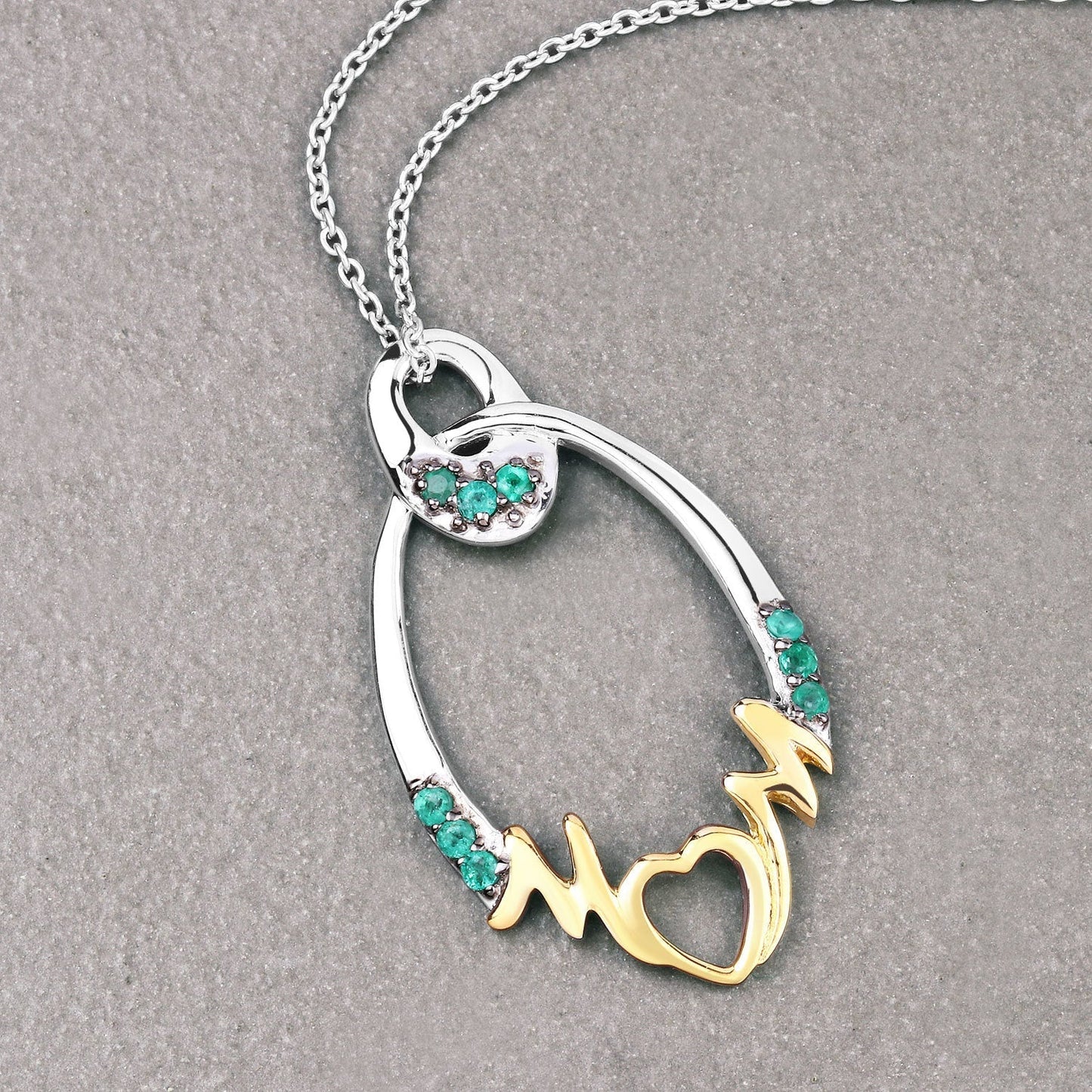0.15 Carat Genuine Emerald .925 Sterling Silver Pendant Bids.com
