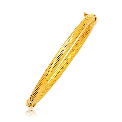 14k Yellow Gold Polished Cable Motif Bangle Bids.com