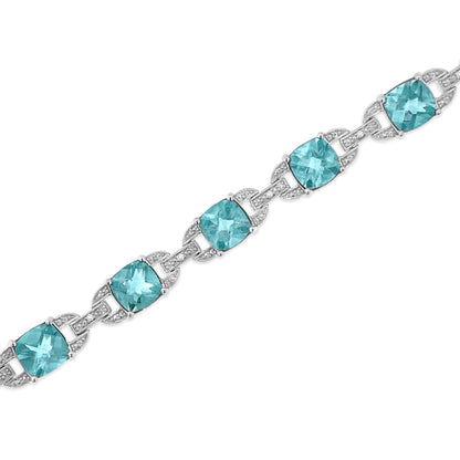 .925 Sterling Silver 7x7 mm Cushion Cut Blue Topaz and 1/20 cttw Round Cut Diamond Fashion Tennis Bracelet (I-J Color, I1-I2 Clarity) - 7" Bids.com