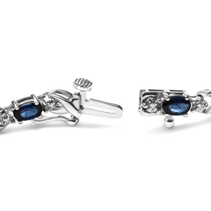 10K White Gold 5x4mm Oval Sapphire Gemstone and 1/10 Cttw Diamond Prong Set "X" Link Bracelet - Size 7" (H-I Color, SI1-SI2 Clarity) Bids.com