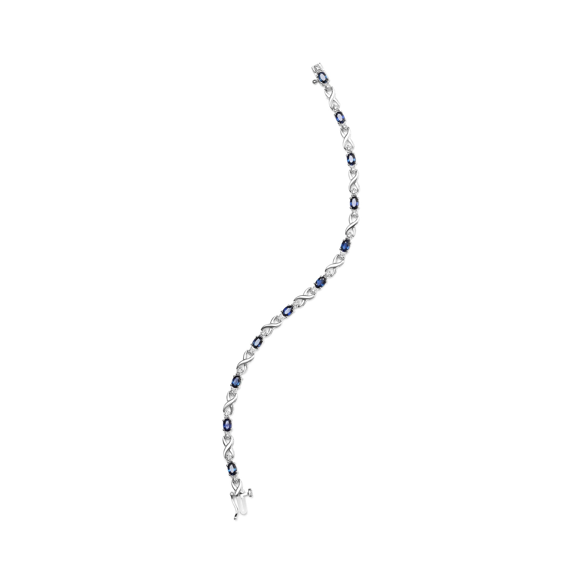 10K White Gold 5x4mm Oval Sapphire Gemstone and 1/10 Cttw Diamond Prong Set "X" Link Bracelet - Size 7" (H-I Color, SI1-SI2 Clarity) Bids.com