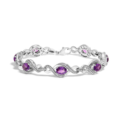 .925 Sterling Silver 1/10 Cttw Natural Round Diamond and 7X5MM Oval Amethyst Cross Tennis Bracelet (I-J Color, I1-I2 Clarity) - 7" Bids.com