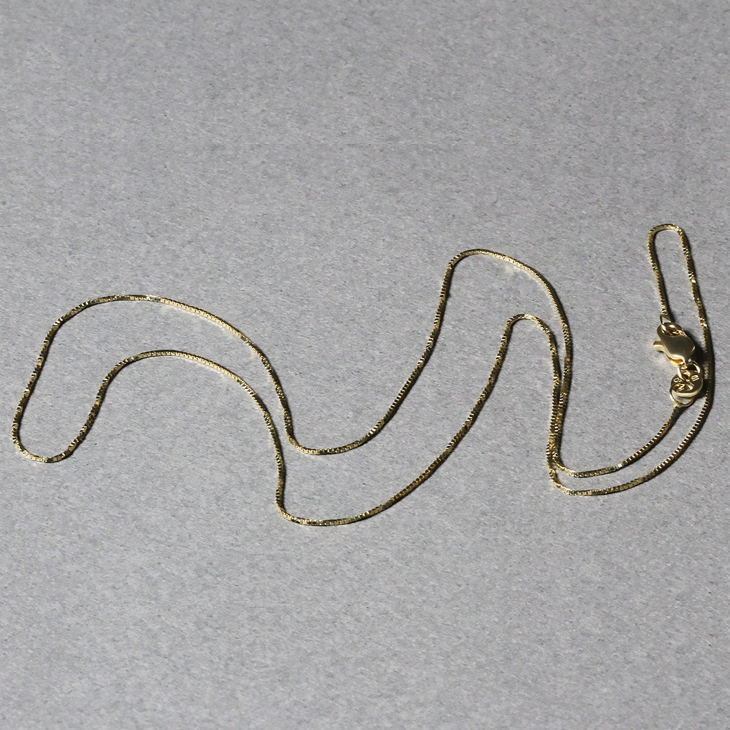 14k Yellow Gold Classic Box Chain 0.6mm Bids.com