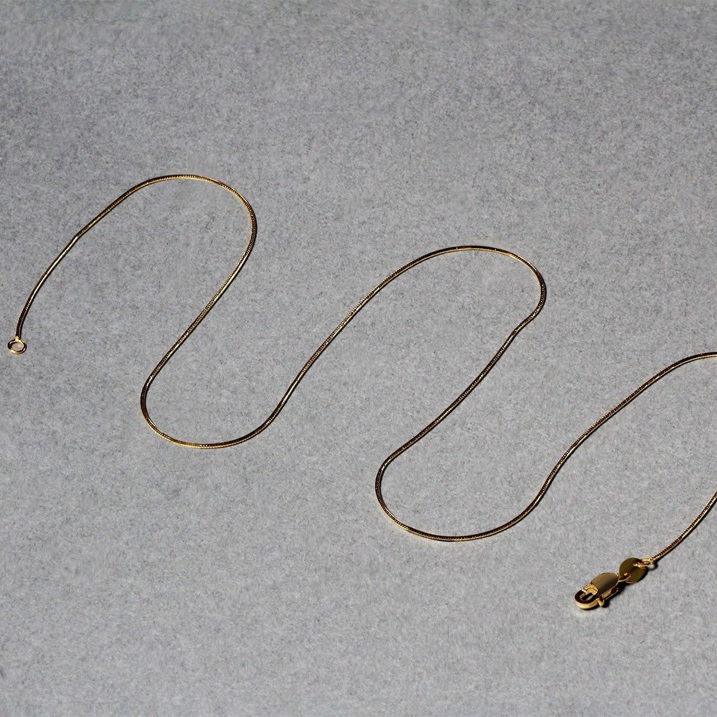 14k Yellow Gold Round Snake Chain 0.7mm Bids.com