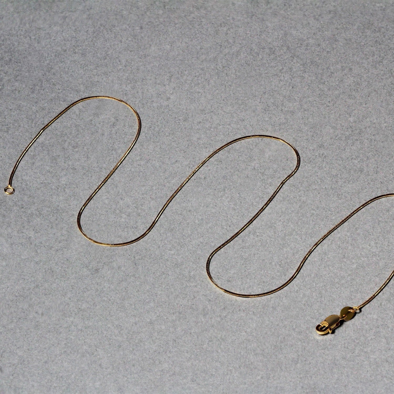 14k Yellow Gold Round Snake Chain 0.7mm Bids.com