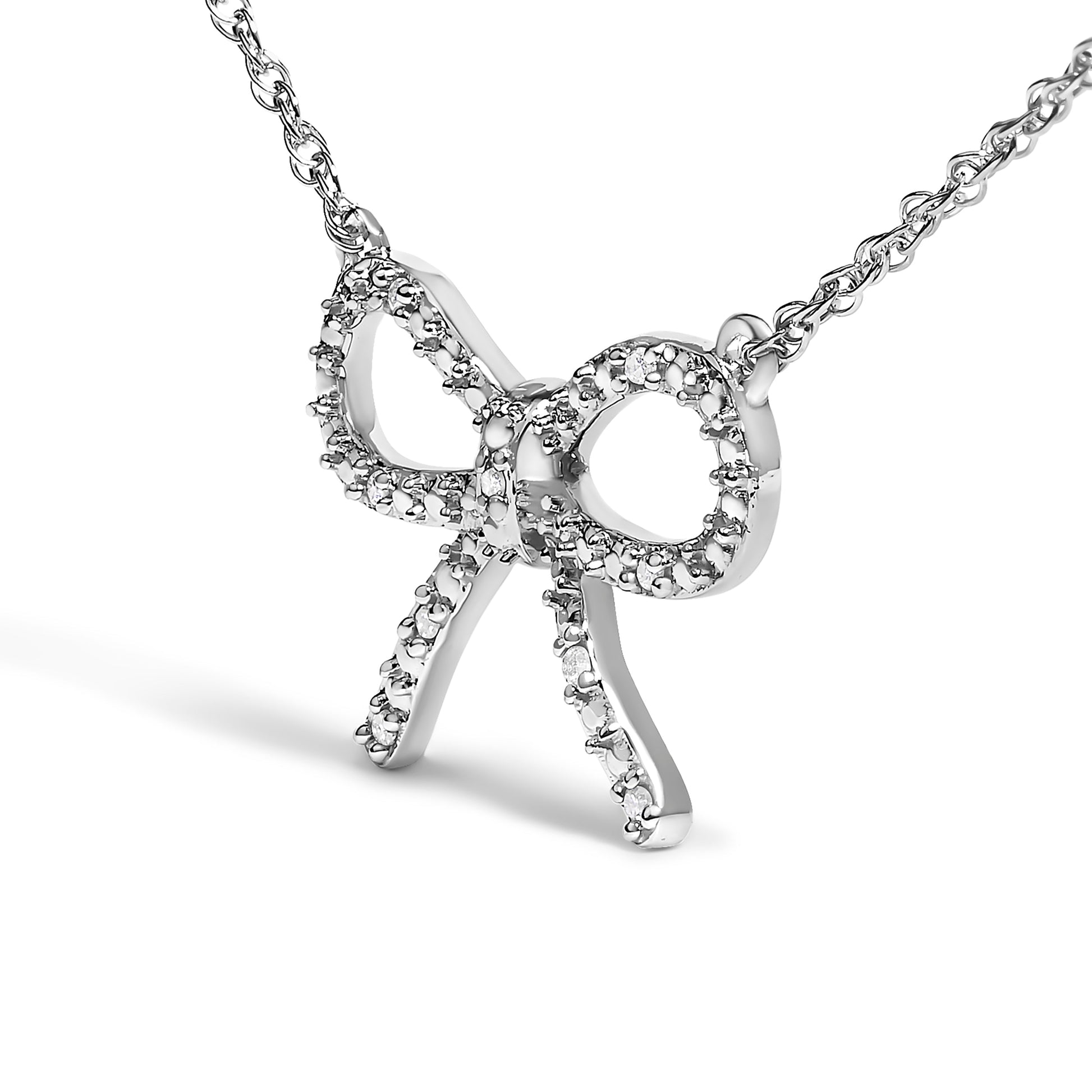 .925 Sterling Silver Diamond Accent Ribbon Bow Knot Pendant Necklace (J-K Color, I2-I3 Clarity) - 18" Inches Bids.com