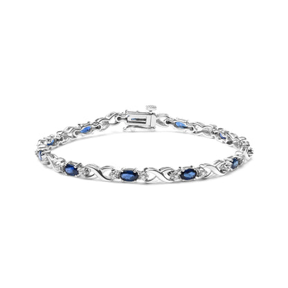 10K White Gold 5x4mm Oval Sapphire Gemstone and 1/10 Cttw Diamond Prong Set "X" Link Bracelet - Size 7" (H-I Color, SI1-SI2 Clarity) Bids.com