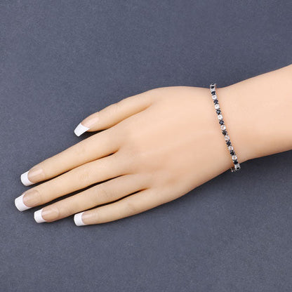 6.87 ct. t.w. Blue Sapphire and White Topaz Bracelet in Sterling Silver Bids.com