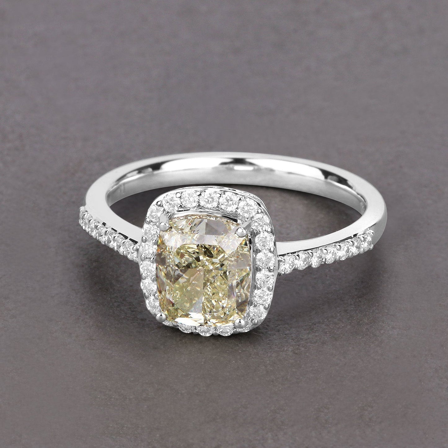 IGI Certified 2.05 Carat Genuine Light Yellow Diamond Center and 0.29cttw White Diamond 18K White Gold Ring (2.34cttw) Bids.com