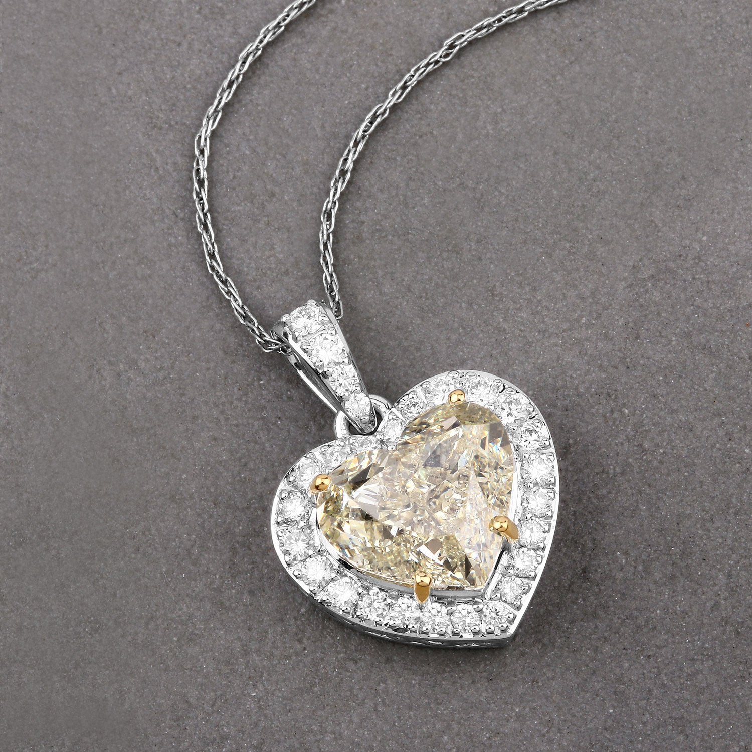 IGI Certified 4.51 Carat Genuine Light Yellow Diamond Center and 0.45cttw White Diamond 18K White Gold Pendant (4.96cttw) Bids.com