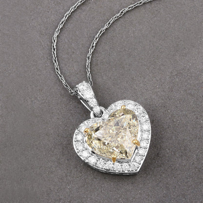 IGI Certified 4.51 Carat Genuine Light Yellow Diamond Center and 0.45cttw White Diamond 18K White Gold Pendant (4.96cttw) Bids.com