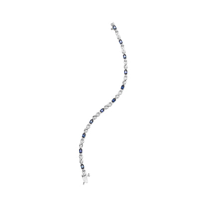 10K White Gold 5x4mm Oval Sapphire Gemstone and 1/10 Cttw Diamond Prong Set "X" Link Bracelet - Size 7" (H-I Color, SI1-SI2 Clarity) Bids.com