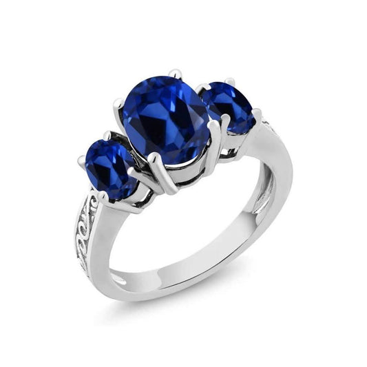 Oval Cut Tri Stone Blue Topaz Ring - Assorted Sizes DailySale