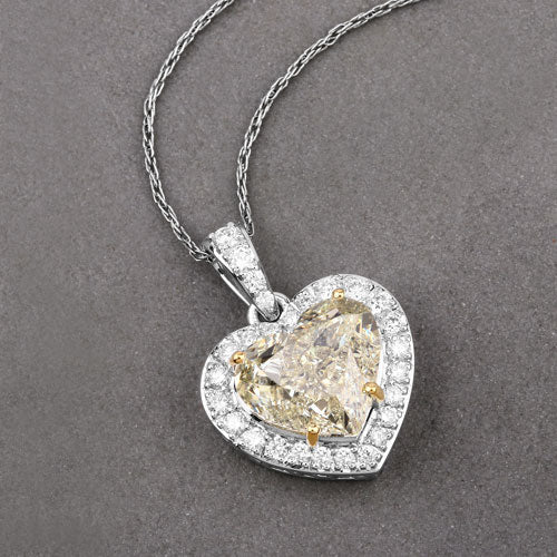 IGI Certified 4.51 Carat Genuine Light Yellow Diamond Center and 0.45cttw White Diamond 18K White Gold Pendant (4.96cttw) Bids.com