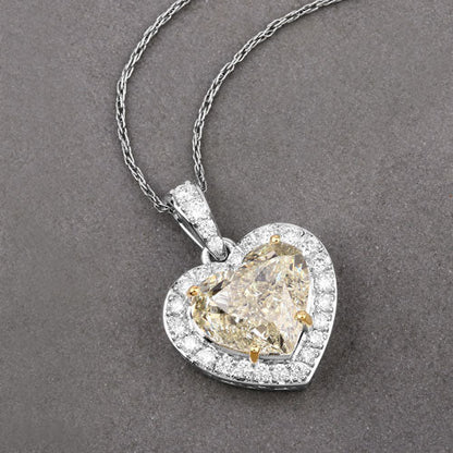 IGI Certified 4.51 Carat Genuine Light Yellow Diamond Center and 0.45cttw White Diamond 18K White Gold Pendant (4.96cttw) Bids.com