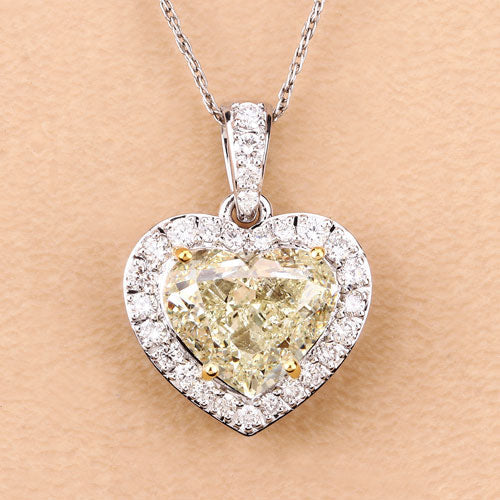 IGI Certified 4.51 Carat Genuine Light Yellow Diamond Center and 0.45cttw White Diamond 18K White Gold Pendant (4.96cttw) Bids.com