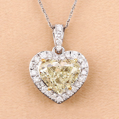 IGI Certified 4.51 Carat Genuine Light Yellow Diamond Center and 0.45cttw White Diamond 18K White Gold Pendant (4.96cttw) Bids.com